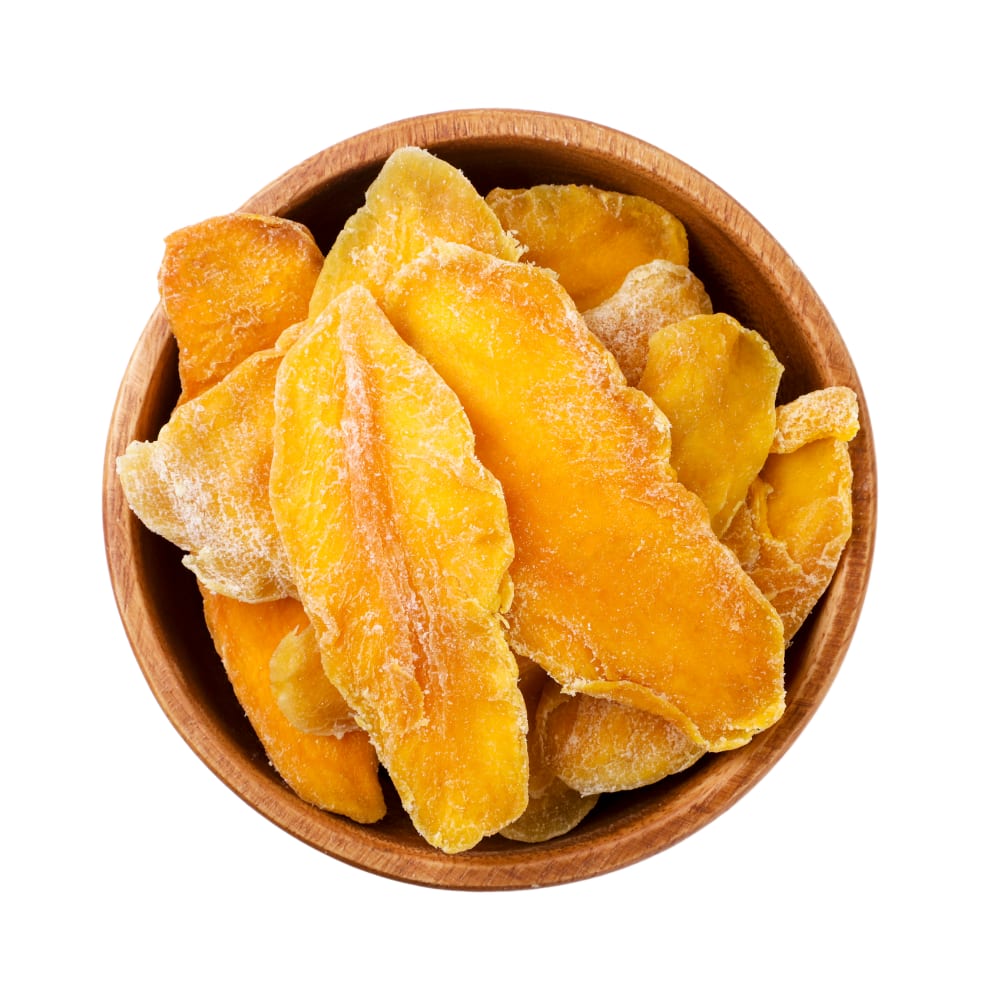 Close-up of dried mango slices arranged in a serving bowl